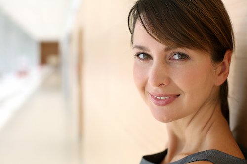 Woman leaning against wall