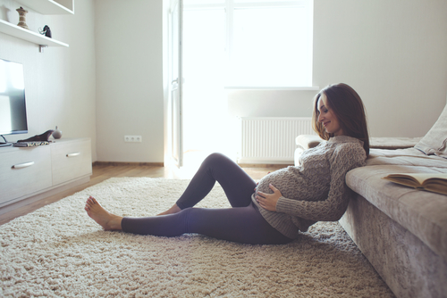 Pregnant Women lying on floor