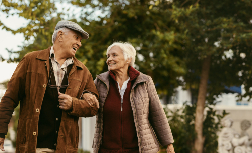 Older couple walking outside