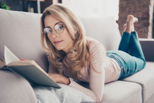 Young woman reading about LASIK eye surgery