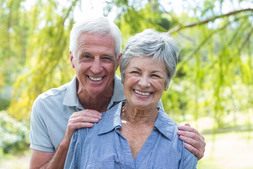 Happy older couple outside