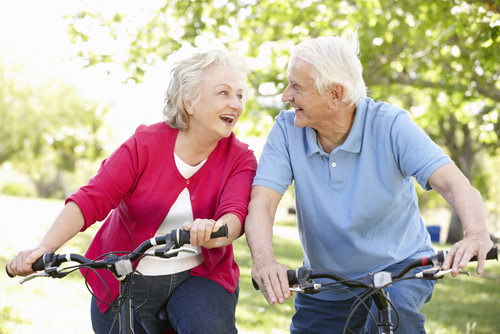 Older couple having fun on bicycles